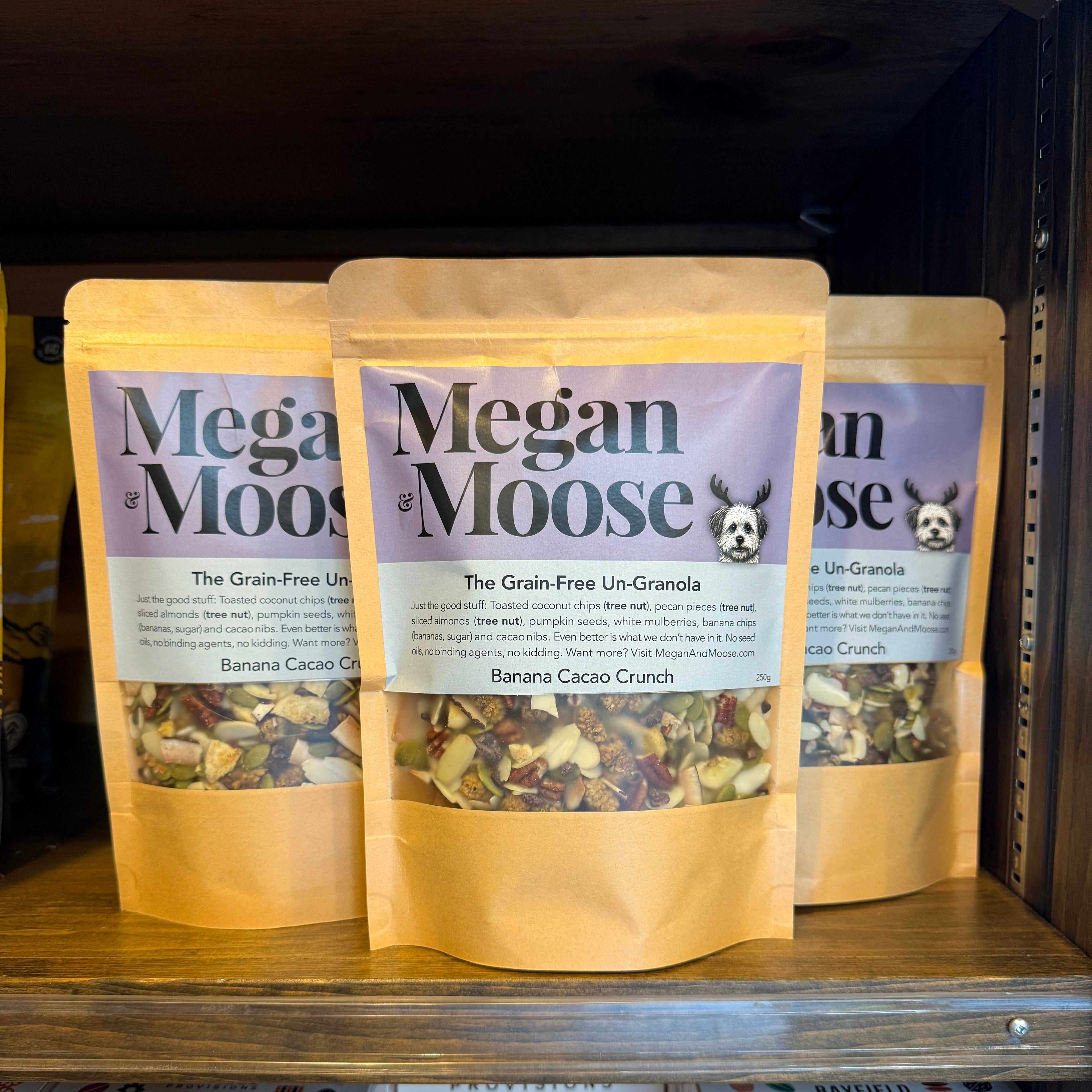 Three packs of Megan & Moose on a store shelf.